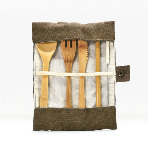 Bamboo cutlery set in a fabric roll with wooden spoons and utensils visible